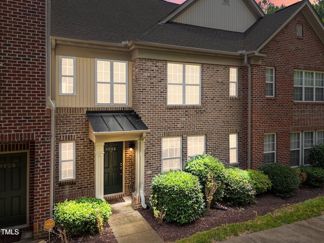 9908 Jerome Ct, Raleigh, NC 27617 - view of front of home with brick siding, board and batten siding, and a shingled roof