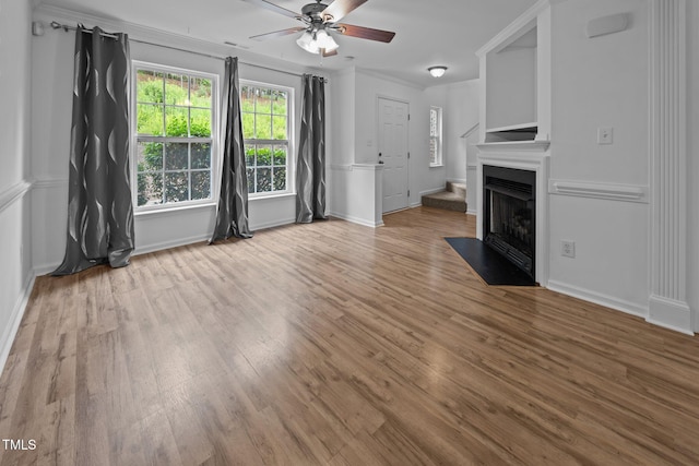 9908 Jerome Ct, Raleigh, NC 27617 - unfurnished living room with a ceiling fan, wood finished floors, a fireplace with flush hearth, and ornamental molding