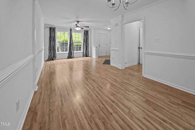 9908 Jerome Ct, Raleigh, NC 27617 - unfurnished living room with ornamental molding, a ceiling fan, light wood-style floors, and a chandelier