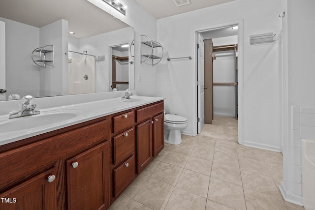 9908 Jerome Ct, Raleigh, NC 27617 - full bath with double vanity, a shower, tile patterned floors, and a spacious closet