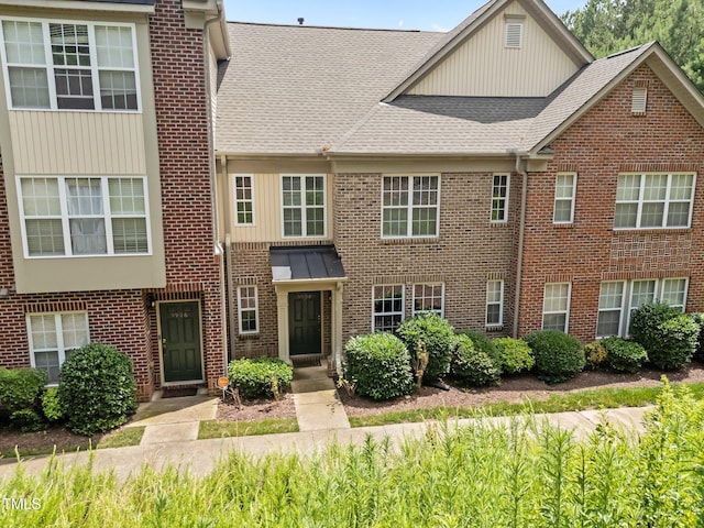 9908 Jerome Ct, Raleigh, NC 27617 - townhome / multi-family property featuring a shingled roof and brick siding