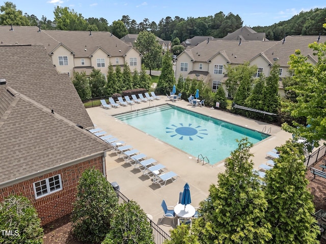 9908 Jerome Ct, Raleigh, NC 27617 - community pool featuring a residential view and a patio
