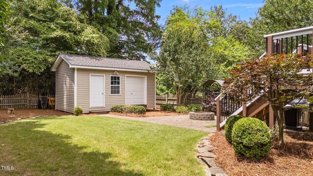 1033 Mills St, Raleigh, NC 27608 - view of yard with an outdoor fire pit and an outbuilding