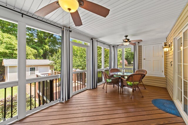 1033 Mills St, Raleigh, NC 27608 - sunroom / solarium with ceiling fan and outdoor dining area
