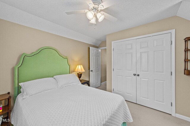 1033 Mills St, Raleigh, NC 27608 - bedroom with lofted ceiling, light carpet, a closet, and ceiling fan