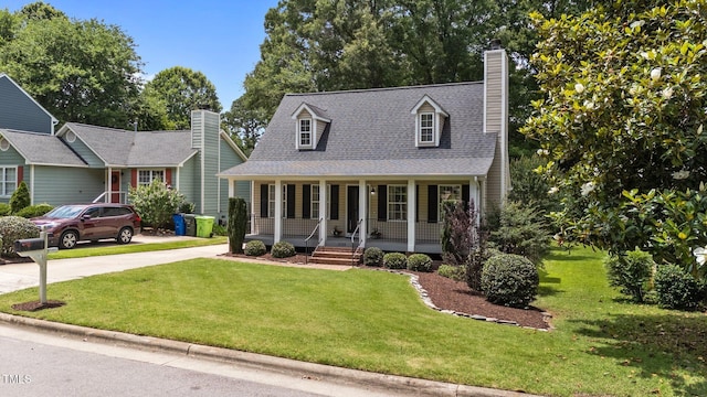 1033 Mills St, Raleigh, NC 27608 - cape cod-style house with a porch, a chimney, a front yard, driveway, and roof with shingles