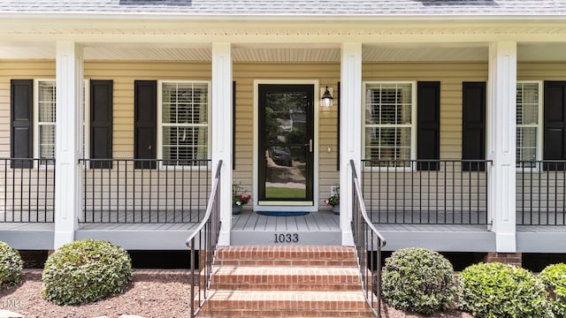 1033 Mills St, Raleigh, NC 27608 - entrance to property featuring covered porch and a shingled roof