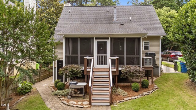 1033 Mills St, Raleigh, NC 27608 - rear view of property with a sunroom, a shingled roof, a chimney, and stairs