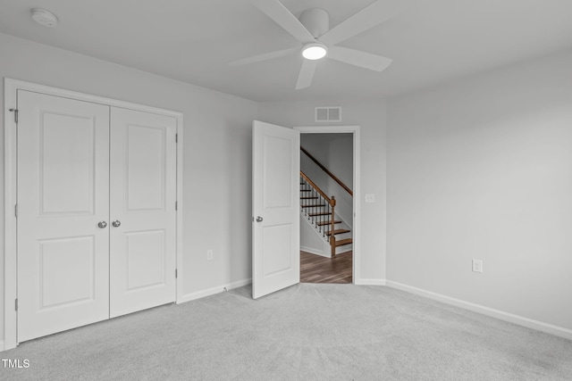 2539 Kasota Ln, Raleigh, NC 27610 - unfurnished bedroom featuring carpet flooring, a closet, and a ceiling fan