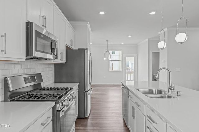 2539 Kasota Ln, Raleigh, NC 27610 - kitchen featuring stainless steel appliances, crown molding, light countertops, tasteful backsplash, and white cabinets