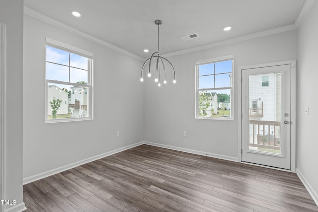 2539 Kasota Ln, Raleigh, NC 27610 - unfurnished dining area featuring wood finished floors, crown molding, and recessed lighting
