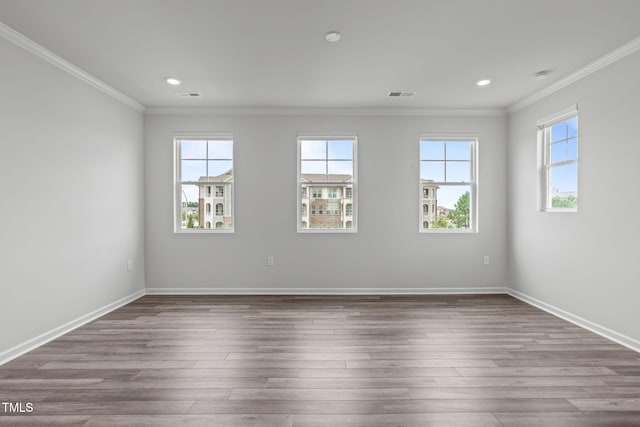 2539 Kasota Ln, Raleigh, NC 27610 - unfurnished room featuring crown molding, recessed lighting, and wood finished floors