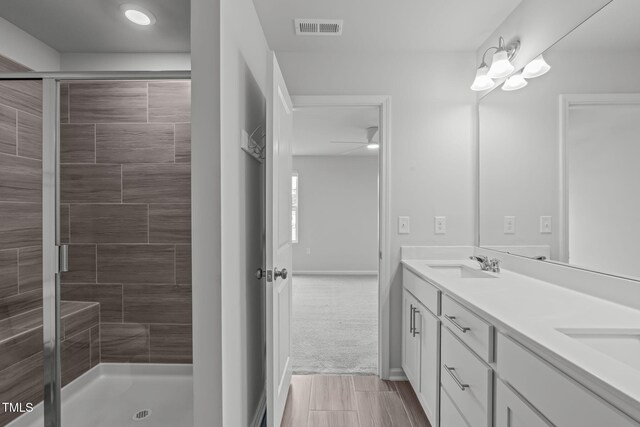 2539 Kasota Ln, Raleigh, NC 27610 - full bathroom featuring double vanity and a shower stall
