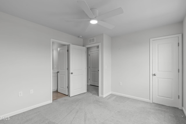 2539 Kasota Ln, Raleigh, NC 27610 - unfurnished bedroom with carpet, ensuite bath, and ceiling fan