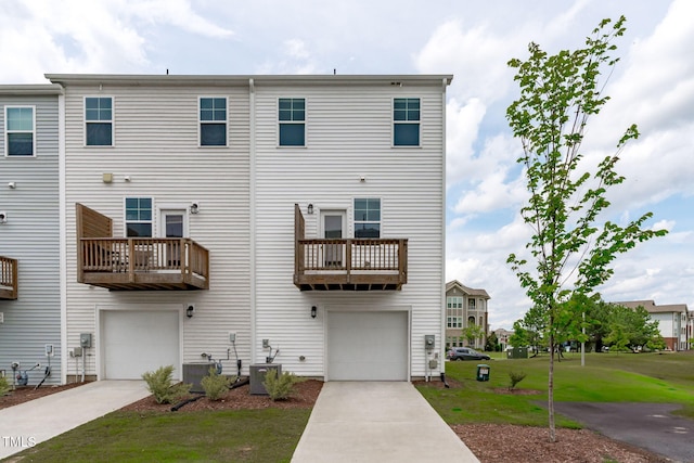 2539 Kasota Ln, Raleigh, NC 27610 - back of house with concrete driveway, a garage, and a lawn