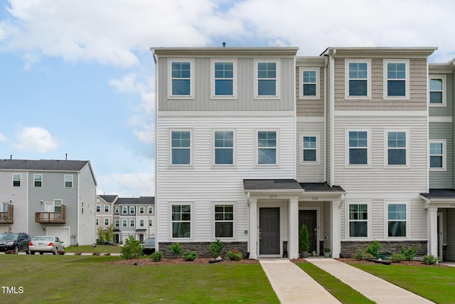 2539 Kasota Ln, Raleigh, NC 27610 - multi unit property featuring stone siding and a front yard