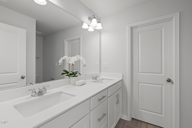 2539 Kasota Ln, Raleigh, NC 27610 - full bathroom with double vanity and wood finished floors