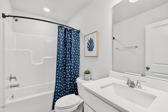 2539 Kasota Ln, Raleigh, NC 27610 - bathroom featuring vanity, shower / bathtub combination with curtain, and recessed lighting