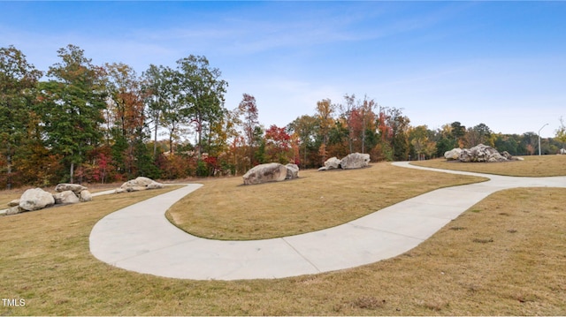 2539 Kasota Ln, Raleigh, NC 27610 - surrounding community featuring a lawn