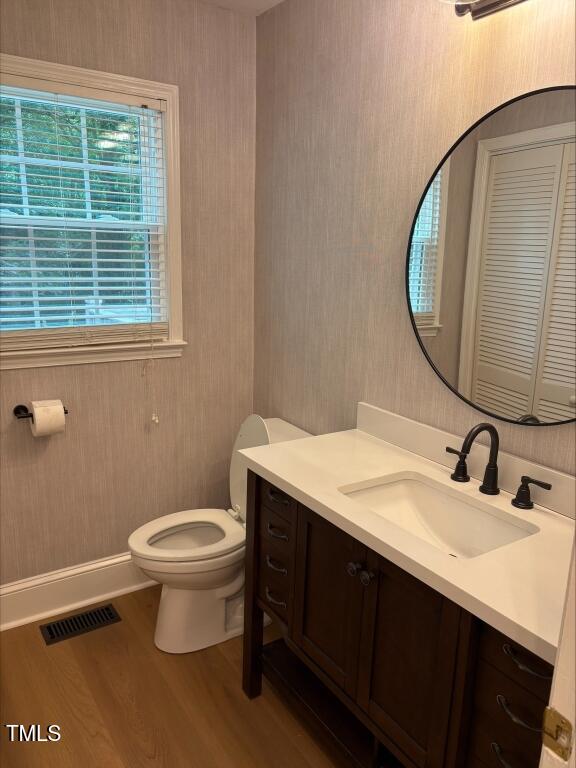 1300 Seabrook Ave, Cary, NC 27511 - bathroom featuring vanity and wood finished floors