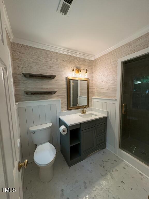 1300 Seabrook Ave, Cary, NC 27511 - full bathroom featuring vanity, a shower stall, and ornamental molding