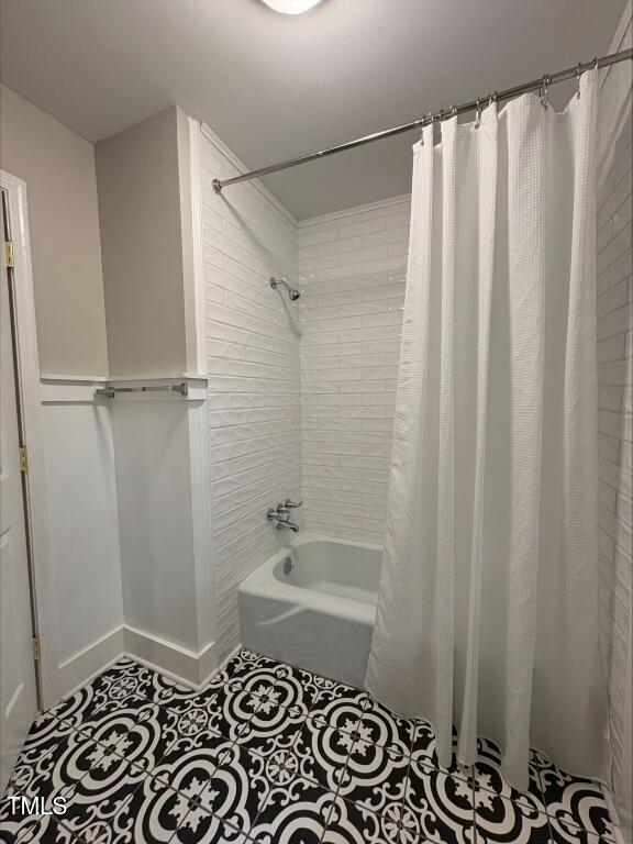 1300 Seabrook Ave, Cary, NC 27511 - full bathroom featuring shower / bath combo with shower curtain and tile patterned floors