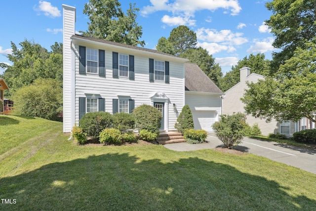 105 Leacroft Way, Durham, NC 27703 - colonial house featuring a garage, a chimney, a front yard, and driveway