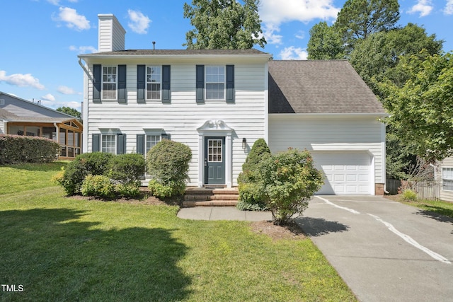 105 Leacroft Way, Durham, NC 27703 - colonial home featuring a garage, a chimney, a front yard, and driveway