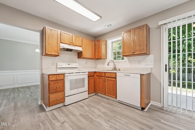 105 Leacroft Way, Durham, NC 27703 - kitchen with white appliances, under cabinet range hood, light wood-style floors, and light countertops