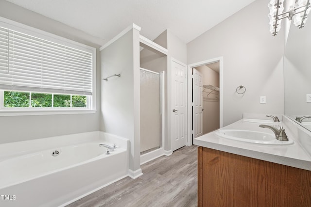105 Leacroft Way, Durham, NC 27703 - full bathroom with a stall shower, a garden tub, wood finished floors, double vanity, and lofted ceiling