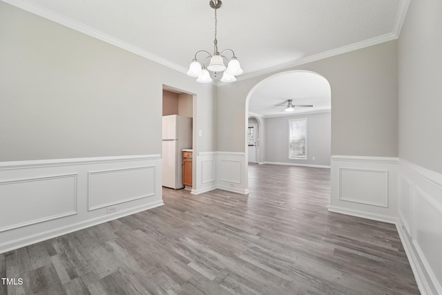 105 Leacroft Way, Durham, NC 27703 - unfurnished room with arched walkways, ornamental molding, a chandelier, wood finished floors, and a wainscoted wall