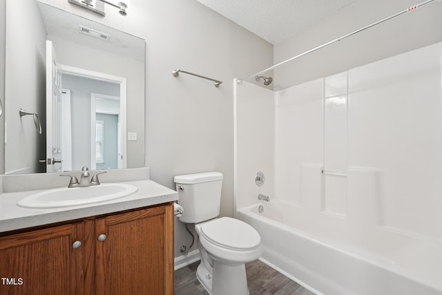 105 Leacroft Way, Durham, NC 27703 - full bathroom featuring vanity, wood finished floors, bathing tub / shower combination, and a textured ceiling
