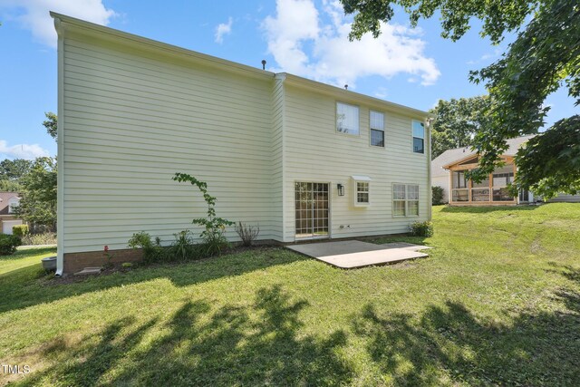 105 Leacroft Way, Durham, NC 27703 - rear view of house featuring a patio area and a lawn