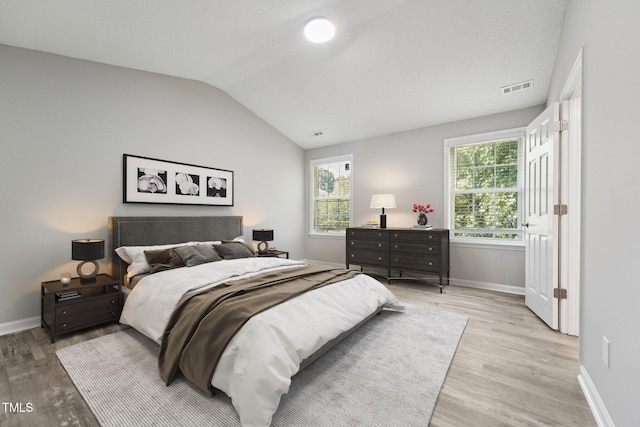 105 Leacroft Way, Durham, NC 27703 - bedroom featuring light wood-type flooring and lofted ceiling