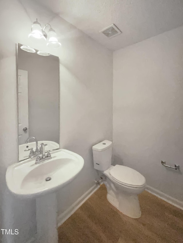 308 Quartz Dr, Durham, NC 27703 - half bathroom with toilet and baseboards