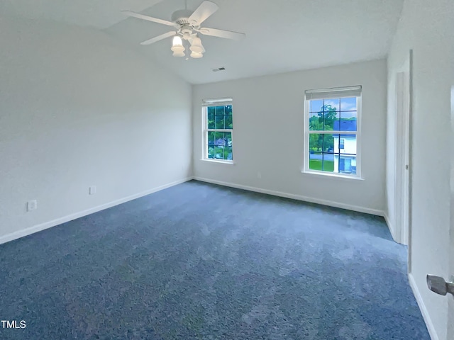 308 Quartz Dr, Durham, NC 27703 - empty room with dark colored carpet, vaulted ceiling, and ceiling fan