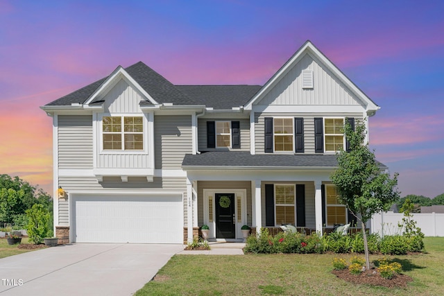 124 Airlie Place Ln, Willow Springs, NC 27592 - view of front facade featuring concrete driveway, board and batten siding, an attached garage, and covered porch