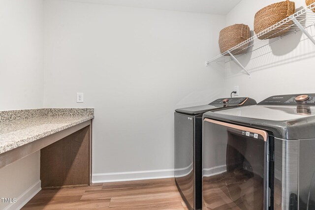 124 Airlie Place Ln, Willow Springs, NC 27592 - washroom with washer and dryer and light wood-style floors