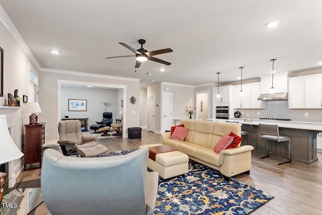 10310 Sablewood Dr Unit 115, Raleigh, NC 27617 - living room featuring light wood-style floors, recessed lighting, a ceiling fan, and crown molding