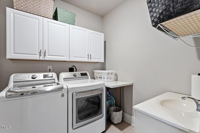 10310 Sablewood Dr Unit 115, Raleigh, NC 27617 - laundry area featuring separate washer and dryer, cabinet space, and light tile patterned flooring