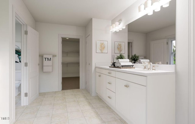 1216 Hardin Hill Ln, Knightdale, NC 27545 - full bathroom with double vanity, a spacious closet, and tile patterned flooring