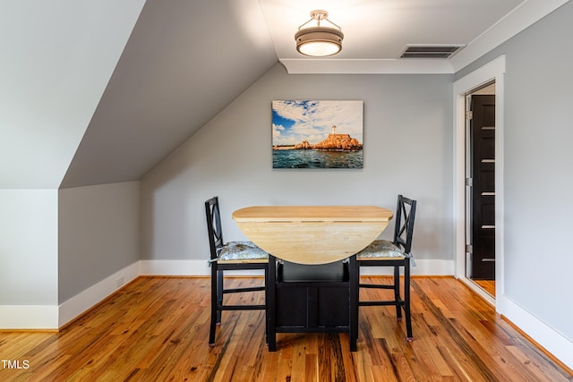 405 Culvert St, Apex, NC 27502 - dining area with wood-type flooring and lofted ceiling
