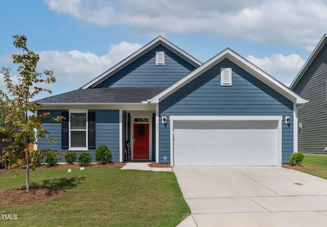 265 Purple Aster St, Youngsville, NC 27596 - view of front of house featuring an attached garage, a front lawn, and driveway