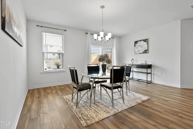 265 Purple Aster St, Youngsville, NC 27596 - dining room featuring a chandelier and wood finished floors