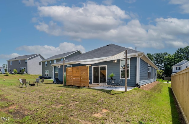 265 Purple Aster St, Youngsville, NC 27596 - back of house featuring a patio and a fire pit