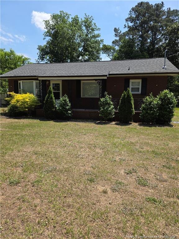 4969 Arlington St, Hope Mills, NC 28348 - ranch-style house featuring a front yard