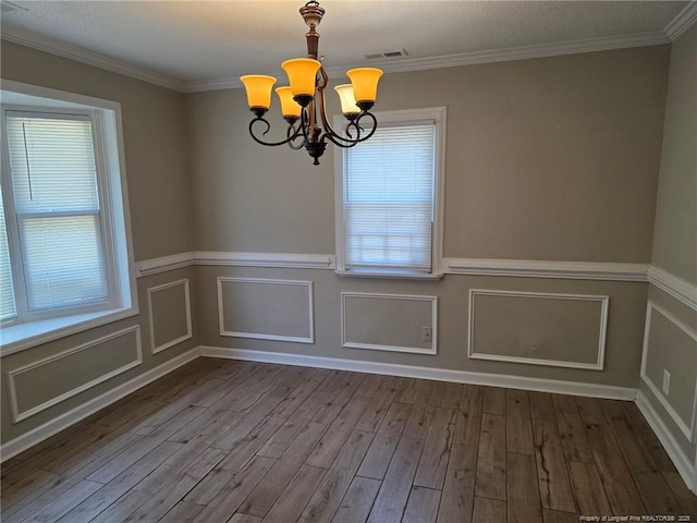 4969 Arlington St, Hope Mills, NC 28348 - spare room with a chandelier, wood finished floors, a wainscoted wall, and crown molding
