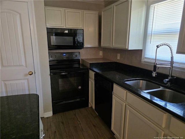 4969 Arlington St, Hope Mills, NC 28348 - kitchen with black appliances, white cabinetry, dark wood-style flooring, and dark stone countertops