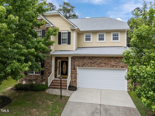 1040 Bellenden Dr, Durham, NC 27713 - view of front of house featuring stone siding, concrete driveway, an attached garage, and roof with shingles