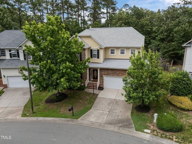 1040 Bellenden Dr, Durham, NC 27713 - traditional-style house with concrete driveway, an attached garage, and roof with shingles